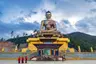 small_Ours._S._Buddha_dordenma_statue_with_monks_and_tourists_in_Thimphu__Bhutan