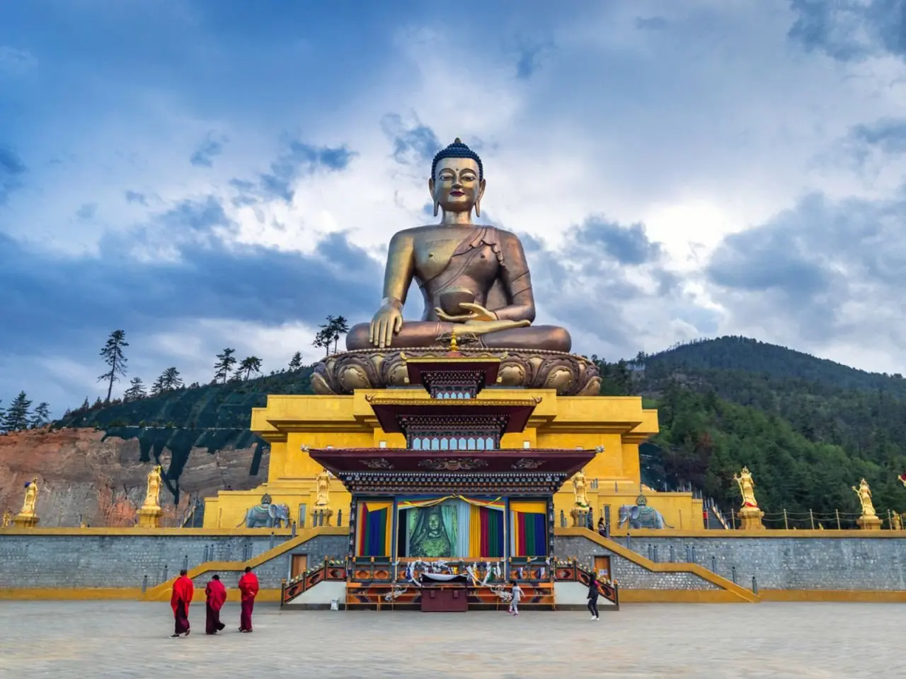 small_Ours._S._Buddha_dordenma_statue_with_monks_and_tourists_in_Thimphu__Bhutan