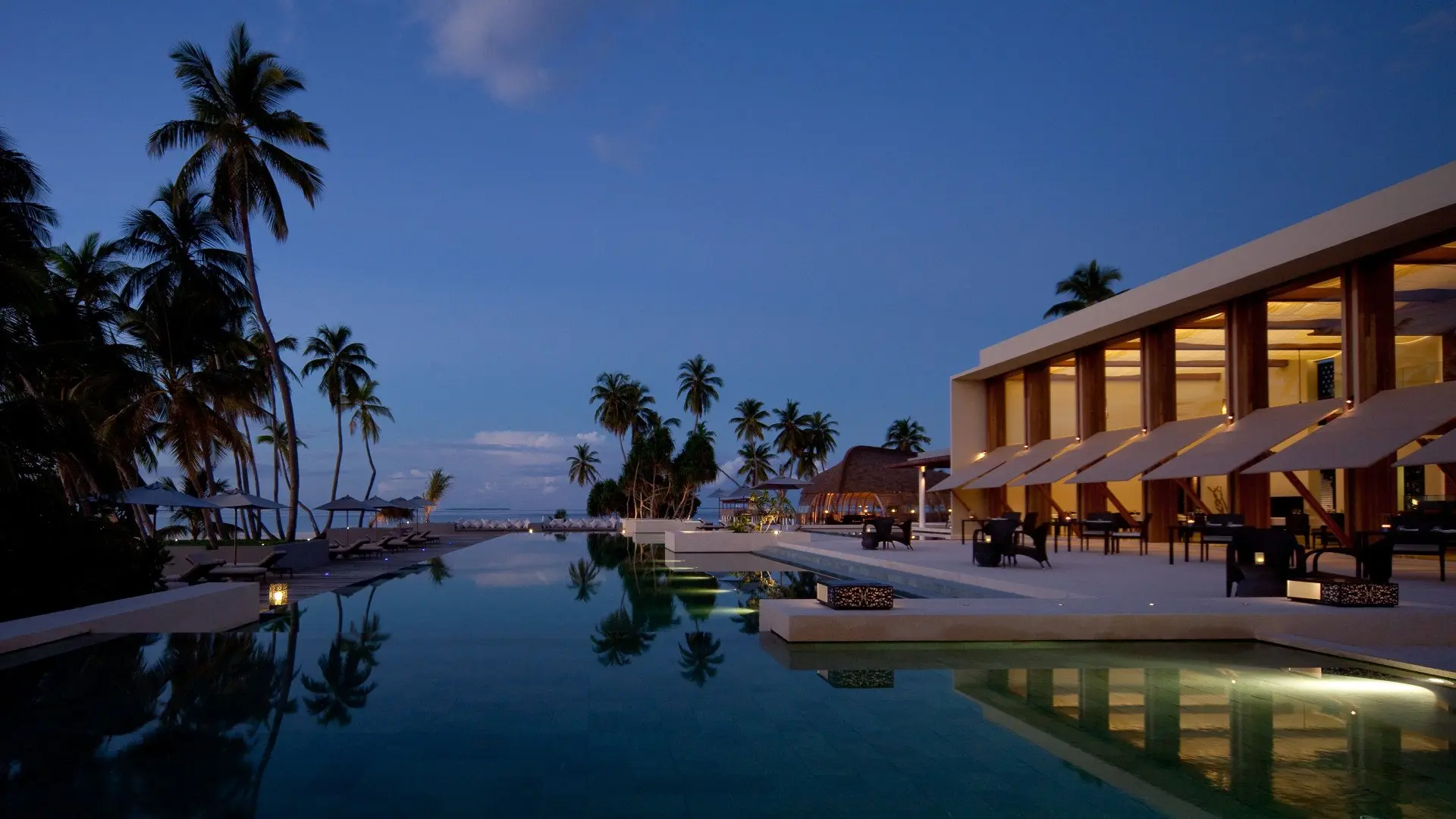 Hadahaa - Main pool & Dining Room at dusk (view from the Bar) (1359)