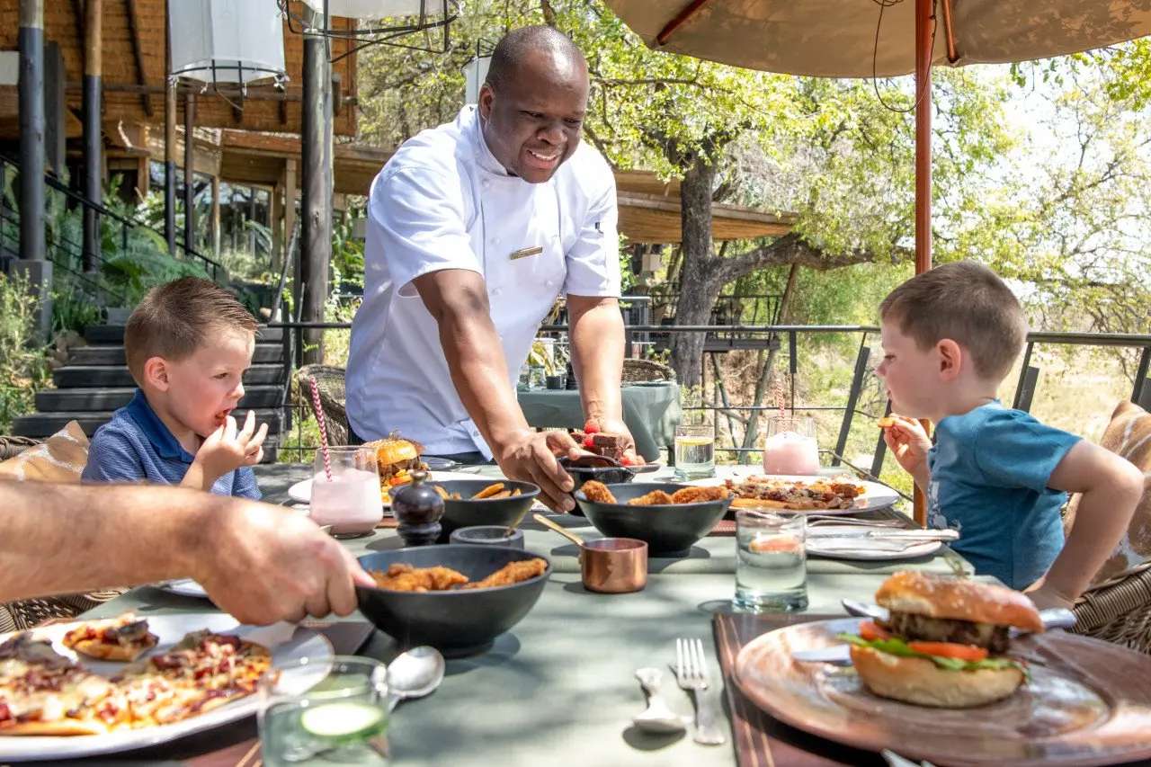 Singita Sabi Sand_Family outdoor lunch with Kids_Ross Couper