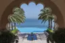 Al Husn pool through courtyard arch A