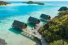 aerial_couple_walking_on_west_overwater_suites_pathway_with_lidi_view