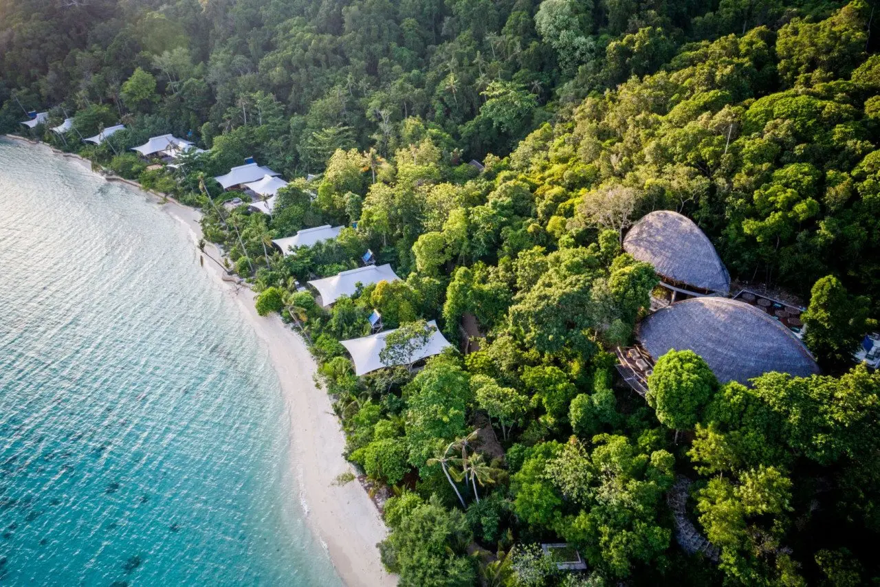 aerial_west_beach_suites_green_forest_background