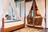 master_bedroom_bathroom_side_canopy_bed_jungle_lodge