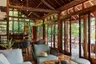 inside_living_and_dining_area_front_view_jungle_lodge_outdoor_deck