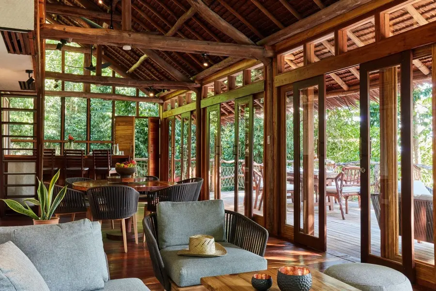 inside_living_and_dining_area_front_view_jungle_lodge_outdoor_deck