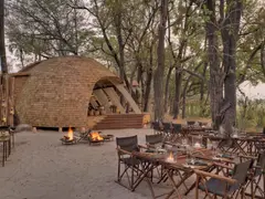 Botswana-Sandibe-Guest-Area-Boma-set-up-for-dinner