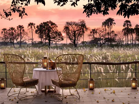 Botswana-Sandibe-Guest-Area-drinks-at-sunset-on-the-deck