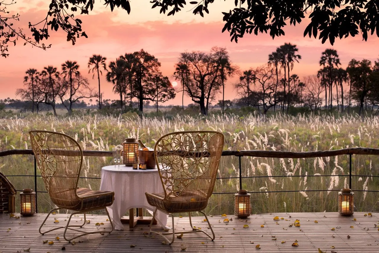 Botswana-Sandibe-Guest-Area-drinks-at-sunset-on-the-deck