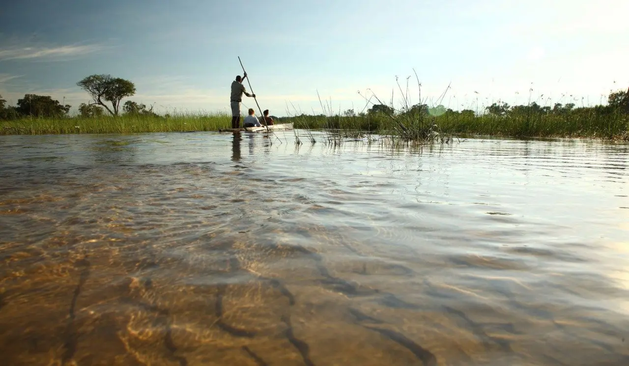 Botswana-Xaranna-Experience-Mokoro-ride-with-guide-far-away