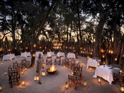 Botswana-Nxabega-Okavango-Tented-Camp-Guest-Area-Boma-with-staff