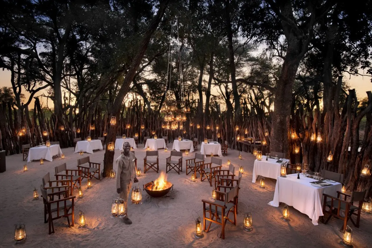 Botswana-Nxabega-Okavango-Tented-Camp-Guest-Area-Boma-with-staff