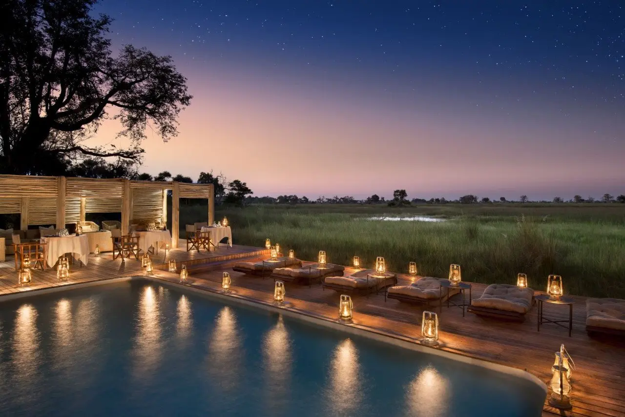 Botswana-Nxabega-Okavango-Tented-Camp-Guest-Area-Deck-dinner-at-the-pool