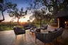 Botswana-Nxabega-Okavango-Tented-Camp-Guest-Area-Deck-at-sunset