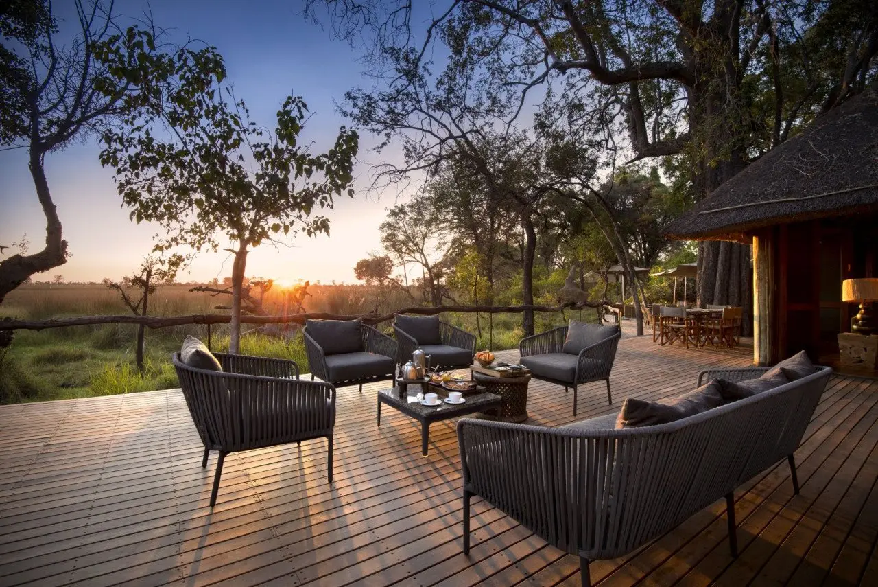 Botswana-Nxabega-Okavango-Tented-Camp-Guest-Area-Deck-at-sunset