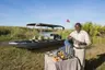 Botswana-Nxabega-Okavango-Tented-Camp-Guest-Delight-butler-setting-up-drinks-after-boat-ride