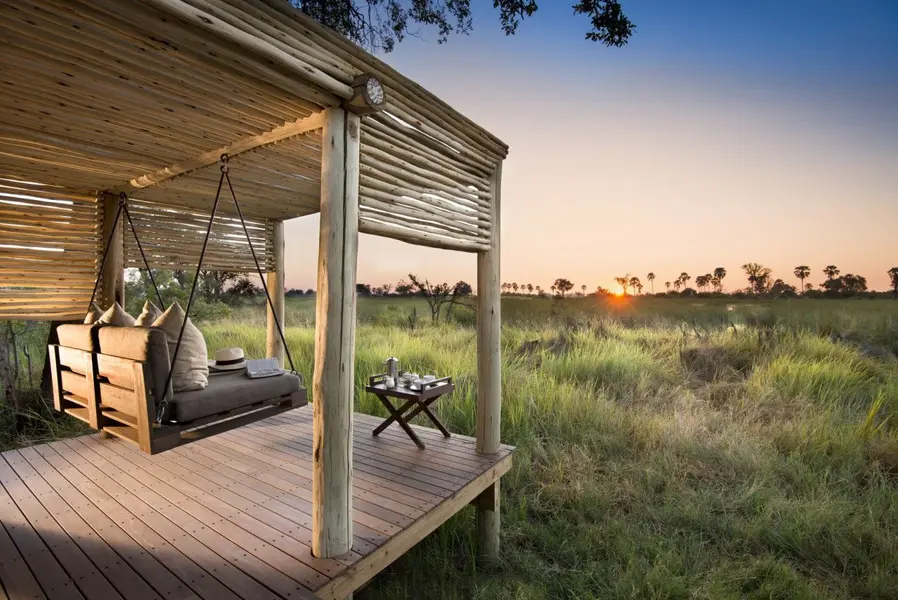 Botswana-Nxabega-Okavango-Tented-Camp-Tent-deck-and-swing-with-a-view