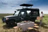 Tanzania-Serengeti-Under-Canvas-SUC-Experience-Bush-lunch-with-branded-vehicle