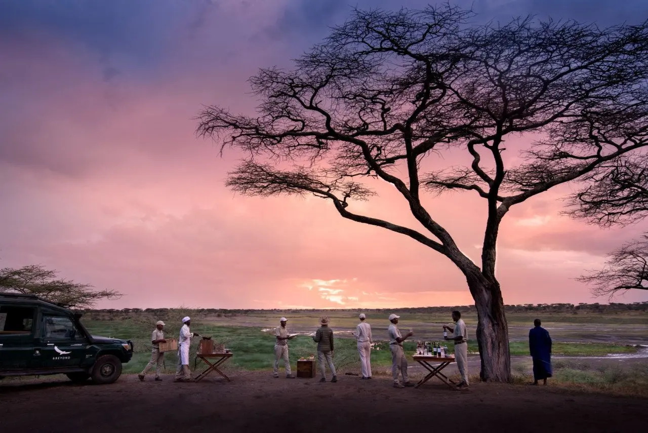 Tanzania-Serengeti-Under-Canvas-SUC-Experience-guest-delight-Bush-safari-Drinks-sundowners-at-sunset-5