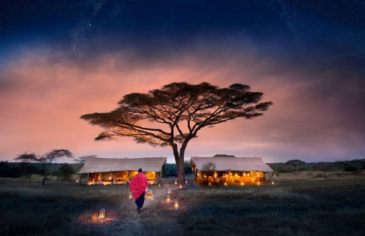 Tanzania-Serengeti-Under-Canvas-SUC-Guest-Area-camp-exterior-with-lantern-walkway-and-Maasai-2