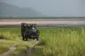 Tanzania-Lake-Manyara-Tree-Lodge-Experience-game-drive-with-the-lake-behind-the-vehicle-2014-5