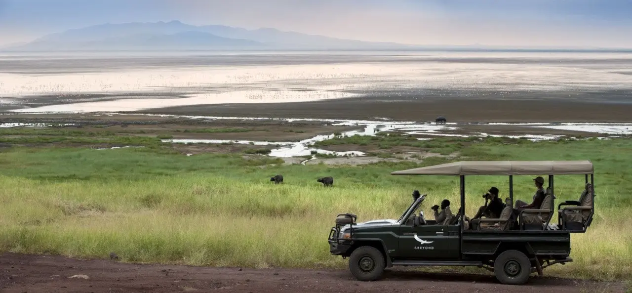 Tanzania-Lake-Manyara-Tree-Lodge-Experience-game-drive-vehicle-next-to-lake-2018-1