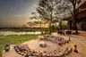 Tanzania-Grumeti-Serengeti-River-Lodge-Guest-Area-firepit-with-sunset