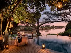 Tanzania-Grumeti-Serengeti-River-Lodge-Experiences-Guest-Delight-Pool-dinner_3