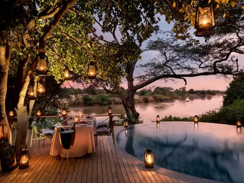 Tanzania-Grumeti-Serengeti-River-Lodge-Experiences-Guest-Delight-Pool-dinner_3