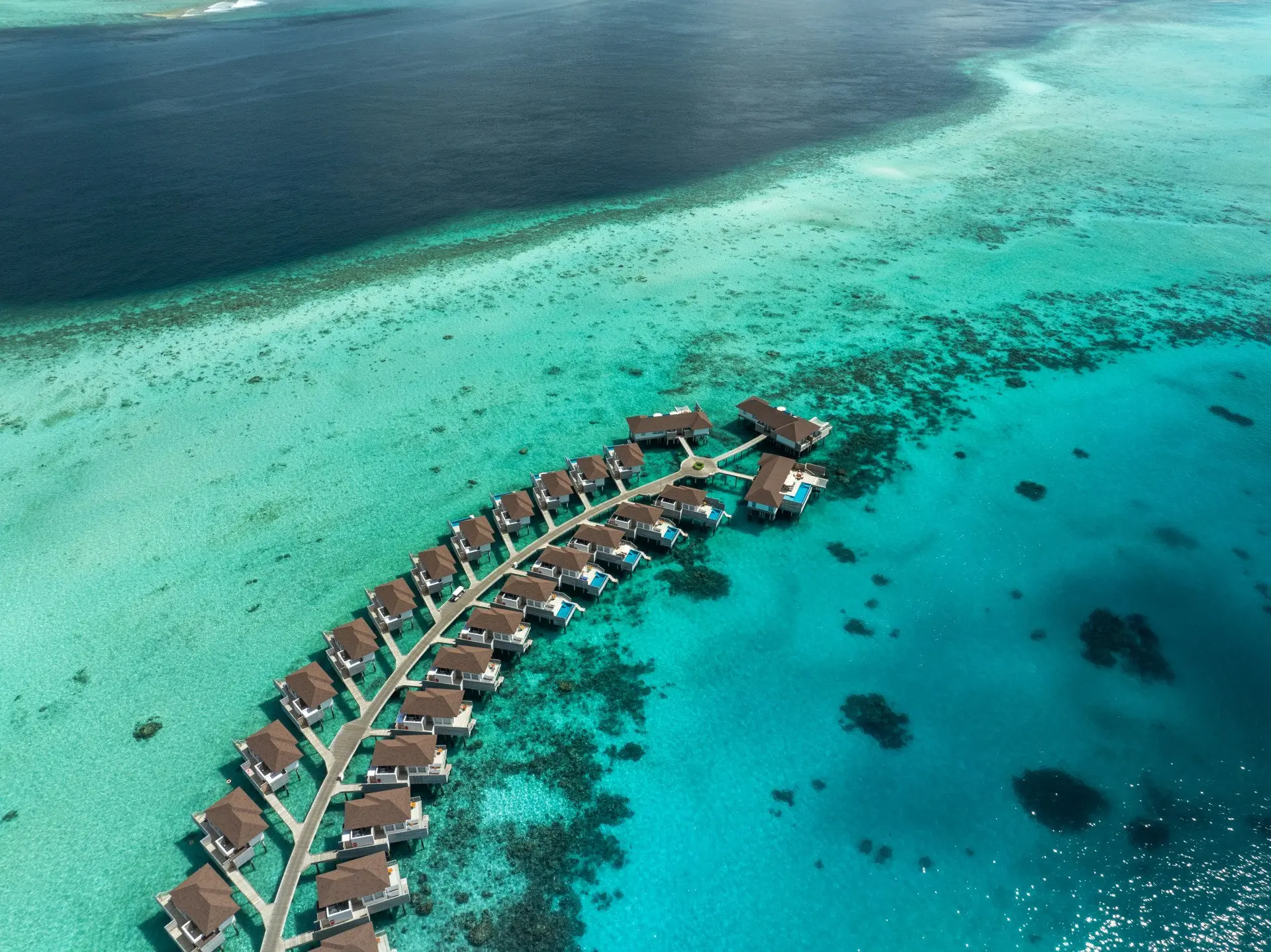 Avani_Plus_Fares_Maldives_Aerial_View_Over_Water_Villas_and_Lagoon