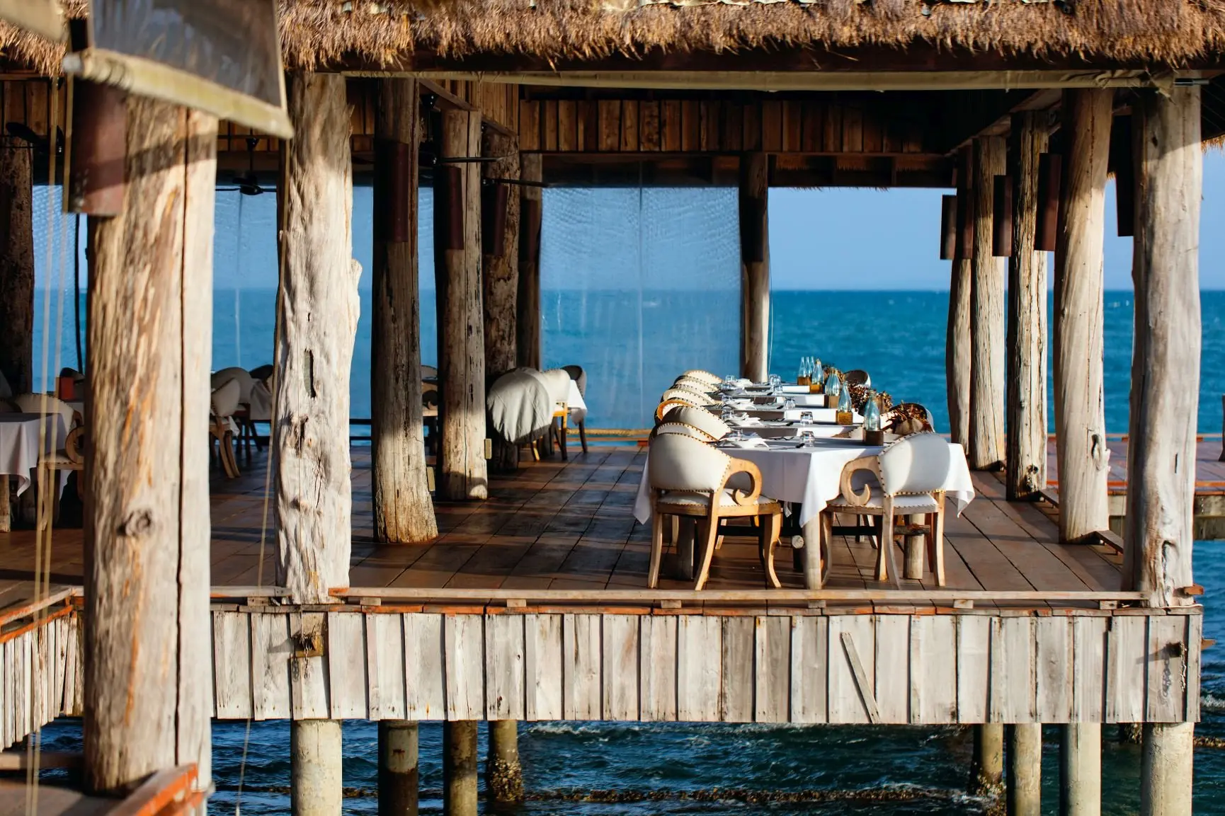 song-saa-private-island-vista-over-water-restaurant-interior-seating-deck-family-photos-2017