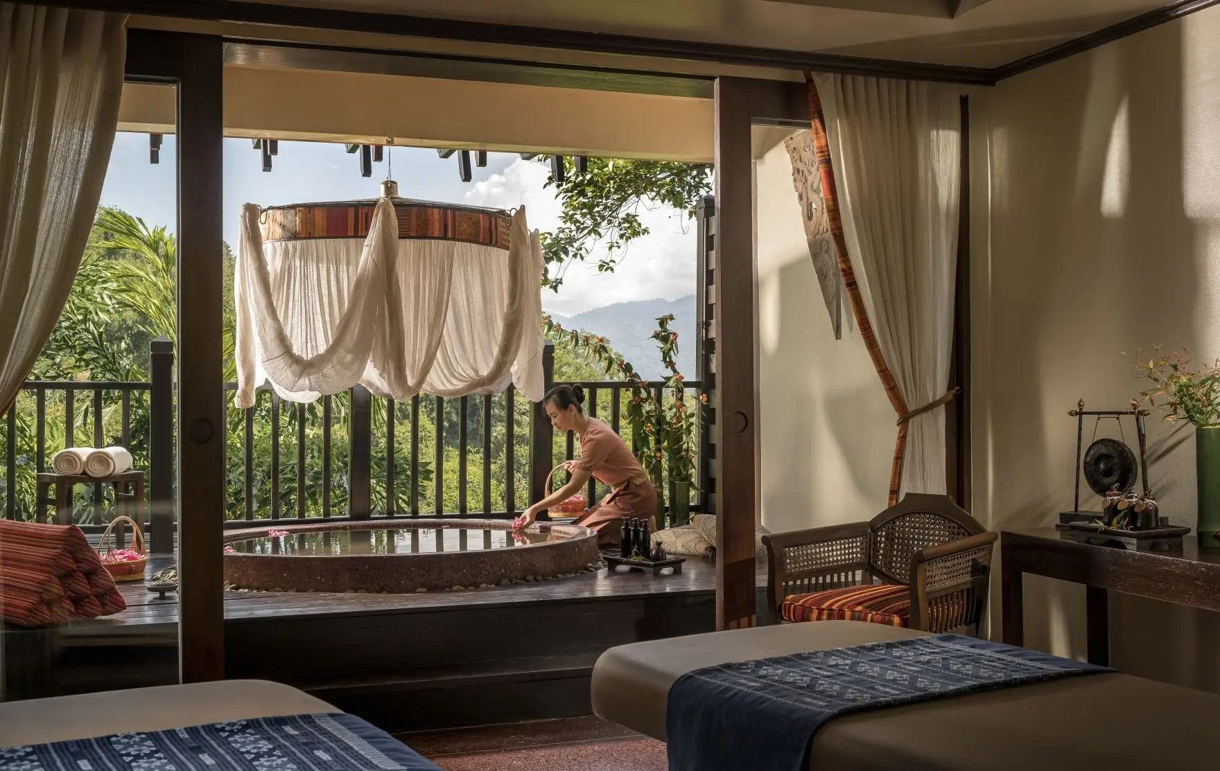 Anantara_Golden_Triangle_Elephant_Camp_And_Resort_Spa_Anantara_Spa_Double_Treatment_Room_With_Therapist_Outside_Next_To_Bath_On_The_Balcony