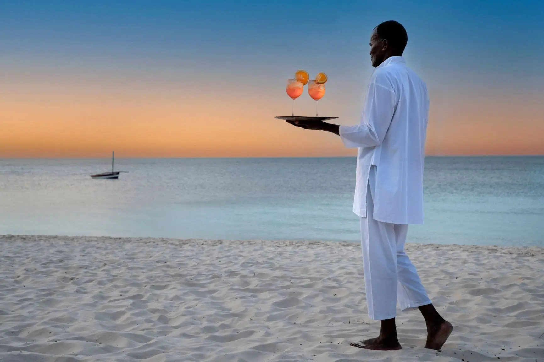 Southern-Africa-Mozambique-andBeyond-Benguerra-Island-butler-drinks-beach