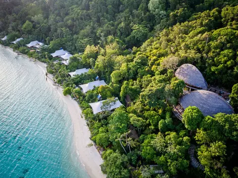 aerial_west_beach_suites_green_forest_background