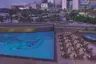 Jumeirah-Emirates-Towers-Swimming-Pool-Dubai-Skyline-Copy-e1520588225915