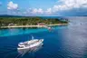 Pelagian-cruises-past-the-resort-on-to-Buton_photo-Didi-Lotze--e1487583745971